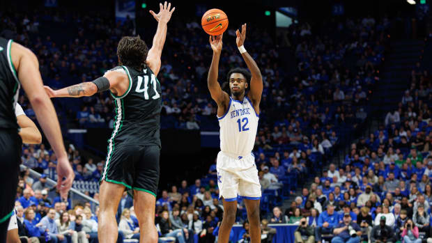 Nov 24, 2023; Lexington, Kentucky, USA; Kentucky Wildcats guard Antonio Reeves (12) shoots the ball during the second half against the Marshall Thundering Herd at Rupp Arena at Central Bank Center. Mandatory Credit: Jordan Prather-USA TODAY Sports