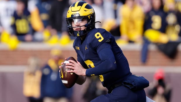 Michigan Wolverines quarterback J.J. McCarthy scrambles during his team’s game against the Ohio State Buckeyes on Nov. 25, 2023.
