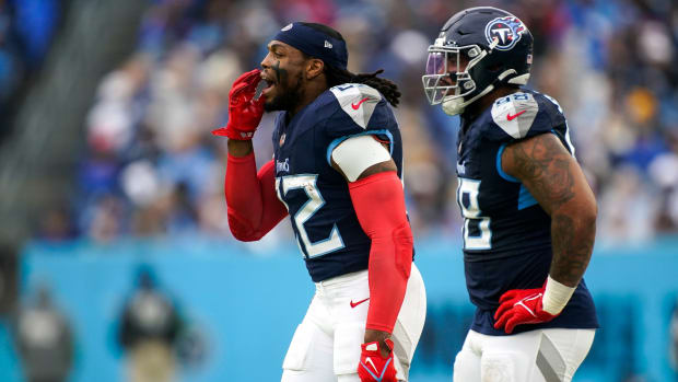 Tennessee Titans running back Derrick Henry (22) and defensive tackle Jeffery Simmons (98) on the sidelines during the second quarter against the Carolina Panthers.