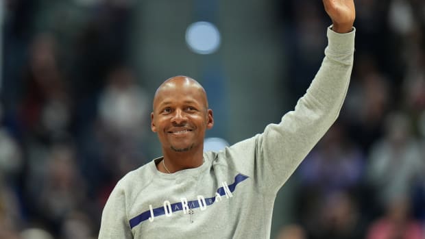 Former UConn Huskies and NBA player Ray Allen steps onto the court 