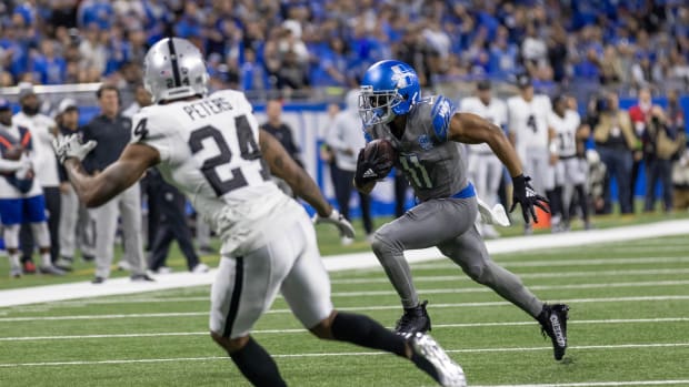 Oct 30, 2023; Detroit, Michigan, USA; Detroit Lions wide receiver Kalif Raymond (11) runs with the ball as Las Vegas Raiders cornerback Marcus Peters (24) chases during the first half at Ford Field.