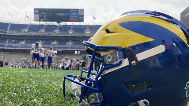 A Delaware helmet rests on the turf at Beaver Stadium before the Blue Hens take on Penn State, Saturday, Sept. 9, 2023 in University Park, Pa.