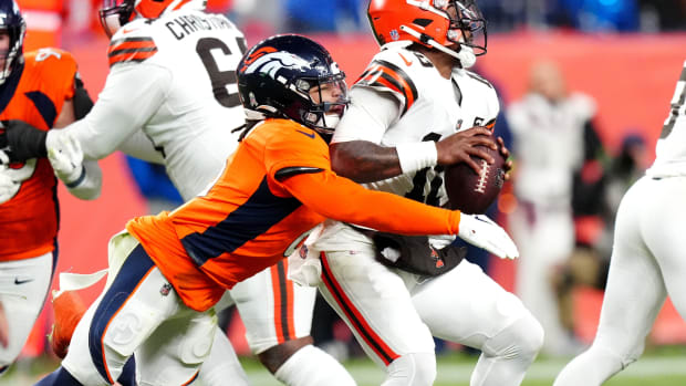 Denver Broncos safety P.J. Locke (6) sacks Cleveland Browns quarterback PJ Walker (10) in the fourth quarter at Empower Field at Mile High.