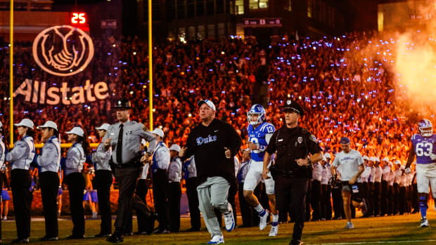 Sep 30, 2023; Durham, North Carolina, USA; Duke Blue Devils head coach Mike Elko runs out just before the game against Notre Dame Fighting Irish at Wallace Wade Stadium.