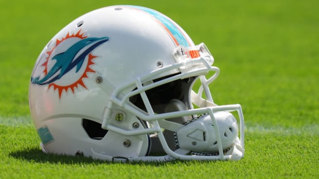 A general view of a Miami Dolphins helmet on the field during practice at Baptist Health Training Complex.