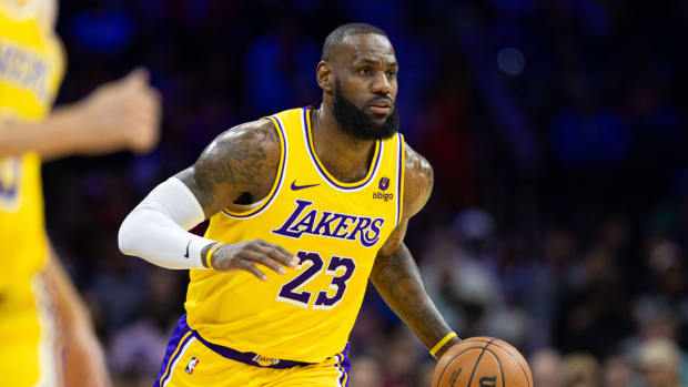 LeBron James brings the ball up for the Los Angeles Lakers at the Philadelphia 76ers.