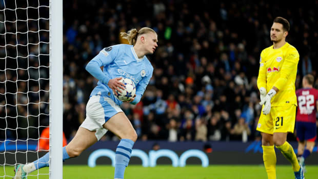 Erling Haaland pictured (left) moments after scoring for Manchester City in a 3-2 win over RB Leipzig in November 2023