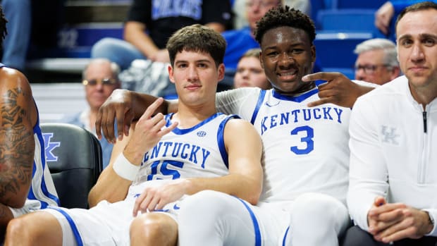 Nov 24, 2023; Lexington, Kentucky, USA; Kentucky Wildcats guard Reed Sheppard (15) poses for a photo with guard Adou Thiero (3) on the bench during the second half against the Marshall Thundering Herd at Rupp Arena at Central Bank Center. Mandatory Credit: Jordan Prather-USA TODAY Sports