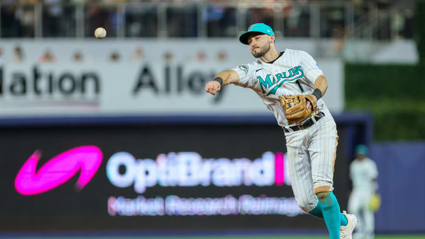 Sep 22, 2023; Miami, Florida, USA; Miami Marlins center fielder Garrett Hampson (1) throws to first base and retires Milwaukee Brewers outfielder Sal Frelick (not pictured) during the fifth inning at loanDepot Park.