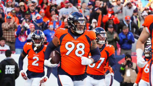 Denver Broncos defensive tackle Mike Purcell (98) following a defensive stop in the first quarter against the Cleveland Browns at Empower Field at Mile High.