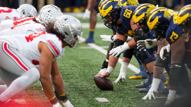 Nov 25, 2023; Ann Arbor, Michigan, USA; Michigan Wolverines offensive lineman Drake Nugent (60) prepares to snap the ball during the NCAA football game against the Michigan Wolverines at Michigan Stadium. Ohio State lost 30-24.