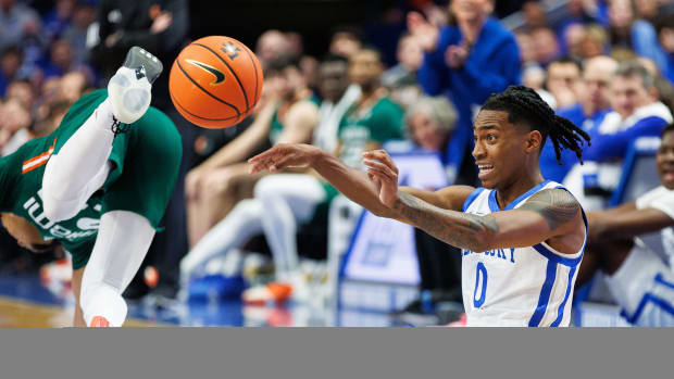Nov 28, 2023; Lexington, Kentucky, USA; Kentucky Wildcats guard Rob Dillingham (0) passes the ball during the first half against the Miami (Fl) Hurricanes at Rupp Arena at Central Bank Center. Mandatory Credit: Jordan Prather-USA TODAY Sports