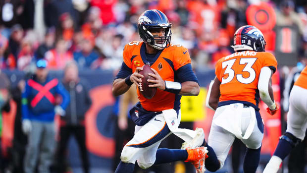 Denver Broncos quarterback Russell Wilson (3) scrambles in the first half against the Cleveland Browns at Empower Field at Mile High.