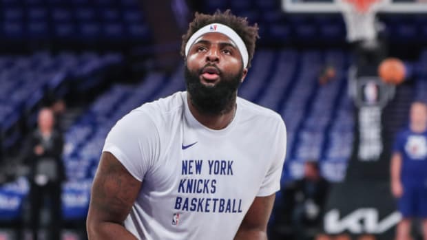 Knicks center Mitchell Robinson warms up before a game.