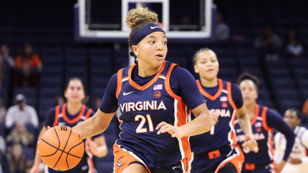 Kymora Johnson dribbles the ball in transition during the Virginia women's basketball Blue-White Scrimmage at John Paul Jones Arena.