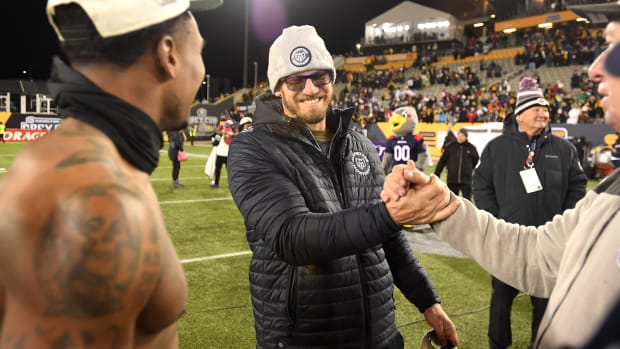 Nov 19, 2023; Hamilton, Ontario, CAN; Montreal Alouettes head coach Jason Maas celebrates with linebacker Tyrice Beverette (26, left) and staff after winning the Grey Cup final against the Winnipeg Blue Bombers at Tim Hortons Field. Mandatory Credit: Dan Hamilton-USA TODAY Sports