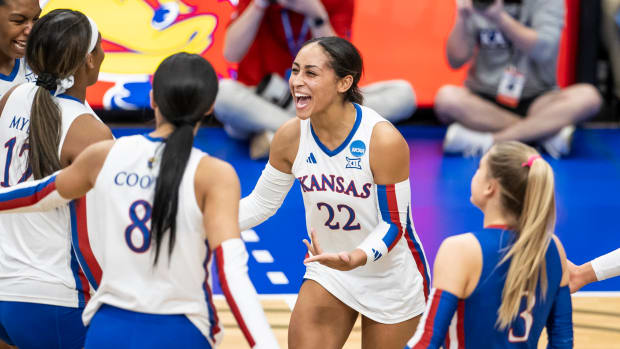 Kansas' Camryn Turner celebrates with teammates after winning a point against Omaha in the first round of the NCAA Tournament.