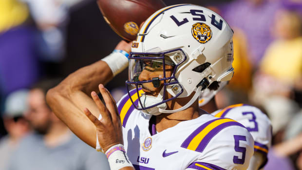 Nov 25, 2023; Baton Rouge, Louisiana, USA; LSU Tigers quarterback Jayden Daniels (5) during warmups before the game against the Texas A&M Aggies at Tiger Stadium. Mandatory Credit: Stephen Lew-USA TODAY Sports