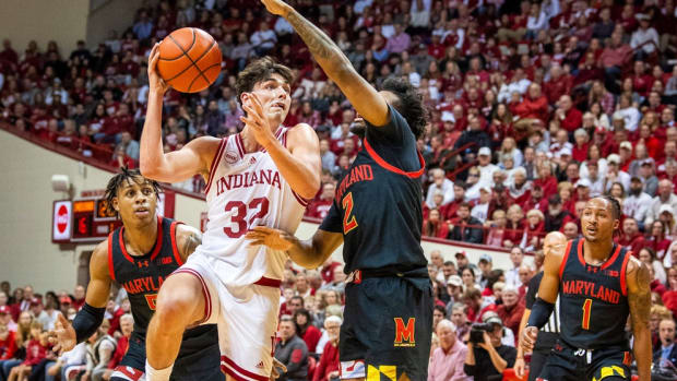 Indiana University's Trey Galloway (32 shoots over Maryland's Jahari Long (2) during the first half of the Indiana versus Maryland men's basketball game at Simon Skjodt Assembly Hall on Friday, Dec. 1, 2023.