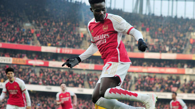 Bukayo Saka pictured celebrating after scoring for Arsenal in a 2-1 win over Wolves in December 2023