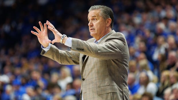 John Calipari gestures to his Kentucky Wildcats players during a game against UNC Wilmington.