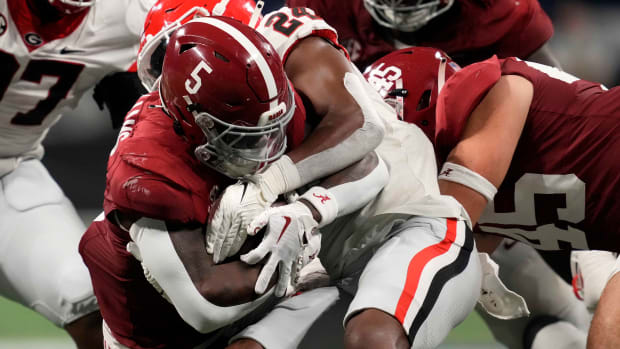 Alabama Crimson Tide running back Roydell Williams (5) rushes the ball against the Georgia Bulldogs during the first half in the SEC Championship game at Mercedes-Benz Stadium.