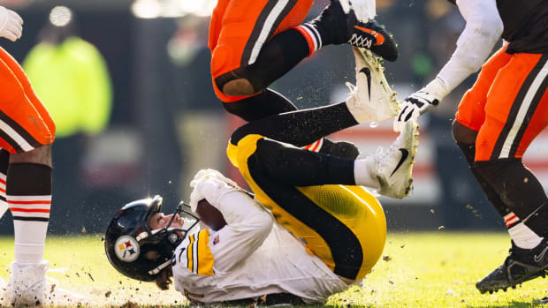 Nov 19, 2023; Cleveland, Ohio, USA; Pittsburgh Steelers quarterback Kenny Pickett (8) rolls on the ground after sliding to avoid a tackle by the Cleveland Browns during the second quarter at Cleveland Browns Stadium. Mandatory Credit: Scott Galvin-USA TODAY Sports