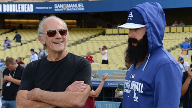 Jun 26, 2014; Los Angeles, CA, USA; Los Angeles Dodgers relief pitcher Brian Wilson (00) talks with actor Christopher Lloyd before the game against the St. Louis Cardinals Dodger Stadium. Mandatory Credit: Jayne Kamin-Oncea-USA TODAY Sports  