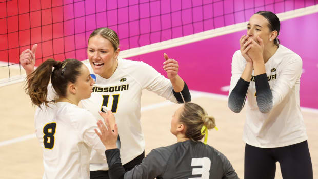 Missouri players celebrate a point against Delaware during the third set of an NCAA women's college volleyball tournament first-round match Friday, Dec. 1, 2023, in Lincoln, Neb.