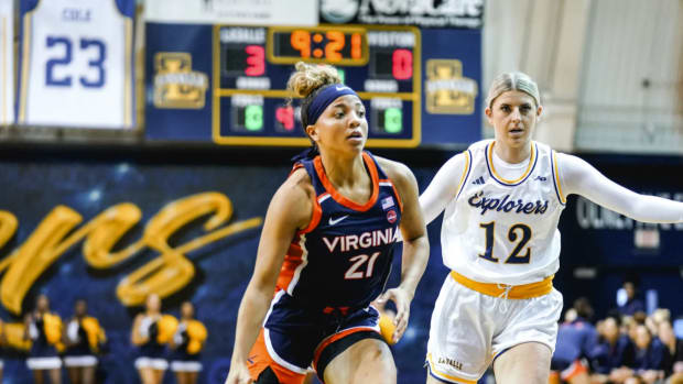 Kymora Johnson drives the ball during the Virginia women's basketball game against La Salle in Philadelphia, Pennsylvania.
