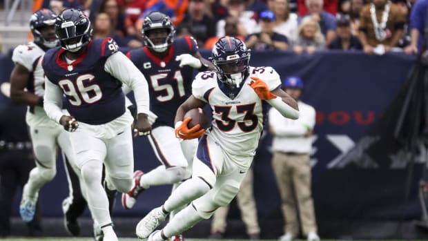 Denver Broncos running back Javonte Williams (33) runs with the ball during the second quarter against the Houston Texans at NRG Stadium.