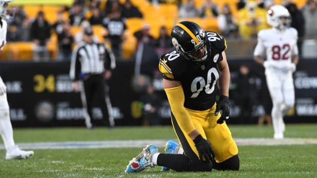 T.J. Watt is slow to get up after a play against the Cardinals.