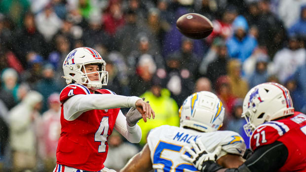 New England Patriots quarterback Bailey Zappe (4) throws a pass against the Los Angeles Chargers in the second quarter at Gillette Stadium.
