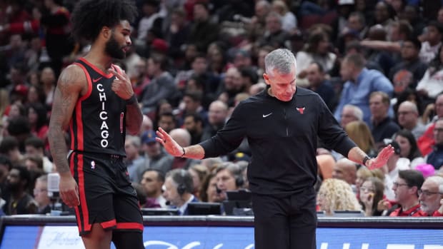 Chicago Bulls head coach Billy Donovan gestures to guard Coby White (0) during the second half at United Center.
