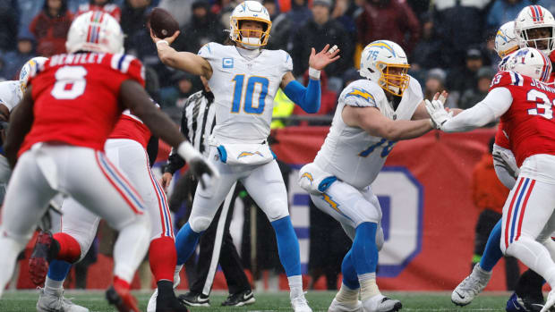 Los Angeles Chargers quarterback Justin Herbert (10) throws during the first half of an NFL football game against the New England Patriots, Sunday, Dec. 3, 2023, in Foxborough, Mass. (AP Photo/Michael Dwyer)   
