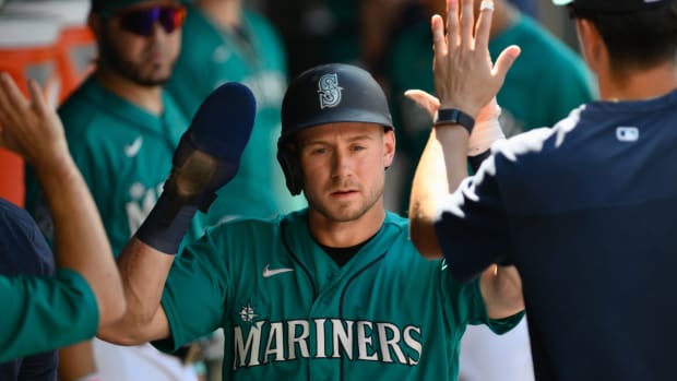 Jul 1, 2023; Seattle, Washington, USA; Seattle Mariners left fielder Jarred Kelenic (10) celebrates in the dugout after scoring a run against the Tampa Bay Rays during the second inning at T-Mobile Park.
