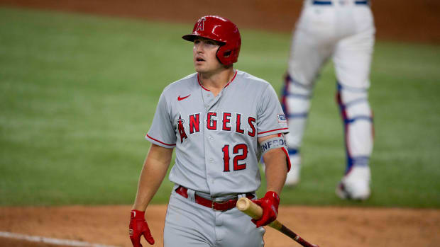 Aug 15, 2023; Arlington, Texas, USA; Los Angeles Angels right fielder Hunter Renfroe (12) walks back to the dugout after striking out against the Texas Rangers during the game at Globe Life Field.