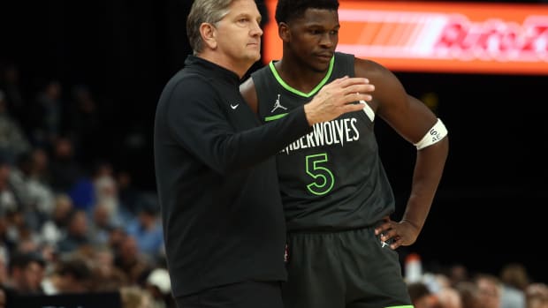 Nov 26, 2023; Memphis, Tennessee, USA; Minnesota Timberwolves head coach Chris Finch talks with Minnesota Timberwolves guard Anthony Edwards (5) during the first half against the Memphis Grizzlies at FedExForum.