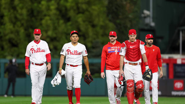 Nov 1, 2022; Philadelphia, PA, USA; Philadelphia Phillies starting pitcher Ranger Suarez (55) and catcher J.T. Realmuto (10) walk in for the bullpen before game three of the 2022 World Series against the Houston Astros at Citizens Bank Park. Mandatory Credit: Bill Streicher-USA TODAY Sports