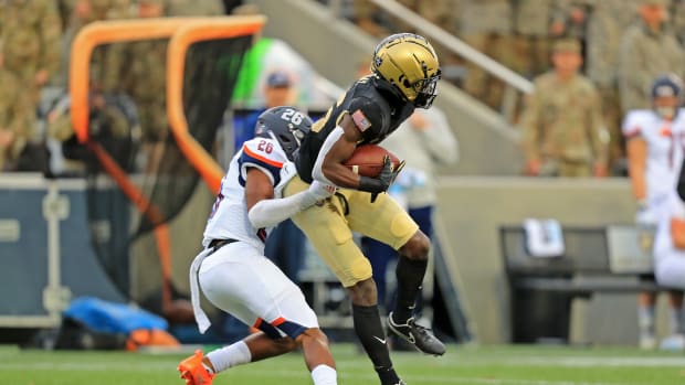 Nov 13, 2021; West Point, New York, USA; Army Black Knights wide receiver Isaiah Alston (86) runs after making a catch in front of Bucknell Bisons cornerback Ethan Robinson (26) during the first half at Michie Stadium. Mandatory Credit: Danny Wild-USA TODAY Sports