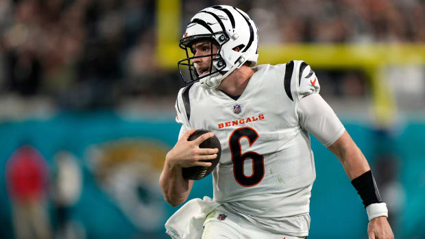 Bengals quarterback Jake Browning carries the ball during Cincinnati's 34-31 overtime win over the Jaguars on Dec. 5, 2023.