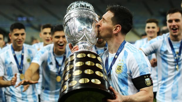 Lionel Messi kissing the Copa America.