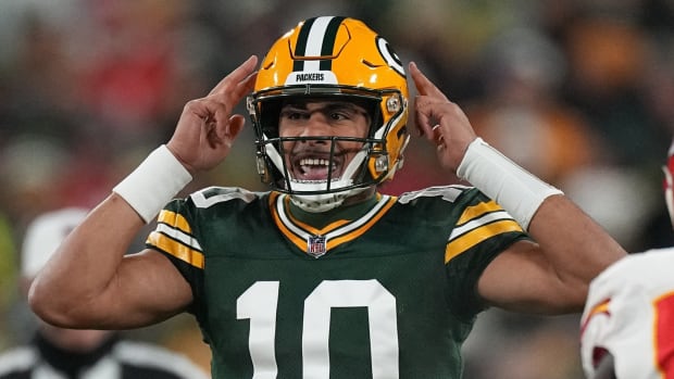 Green Bay Packers quarterback Jordan Love (10) makes an adjustment at the life during the first quarter of their game against the Kansas City Chiefs Sunday, December 3, 2023 at Lambeau Field in Green Bay, Wisconsin.
