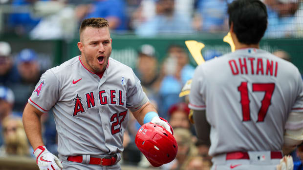 Jun 18, 2023; Kansas City, Missouri, USA; Los Angeles Angels center fielder Mike Trout (27) celebrates with designated hitter Shohei Ohtani (17) after hitting a home run during the fifth inning at Kauffman Stadium.