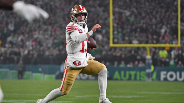 Dec 3, 2023; Philadelphia, Pennsylvania, USA; San Francisco 49ers quarterback Brock Purdy (13) carries the football against the Philadelphia Eagles during the second quarter at Lincoln Financial Field. Mandatory Credit: Eric Hartline-USA TODAY Sports  