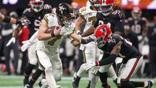 New Orleans Saints quarterback Taysom Hill (7) runs the ball against the Atlanta Falcons