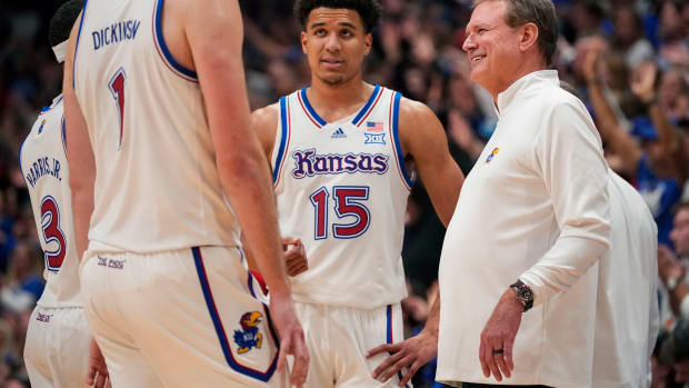 Dec 1, 2023; Lawrence, Kansas, USA; Kansas Jayhawks head coach Bill Self talks with players during a timeout in the second half against the Connecticut Huskies at Allen Fieldhouse.