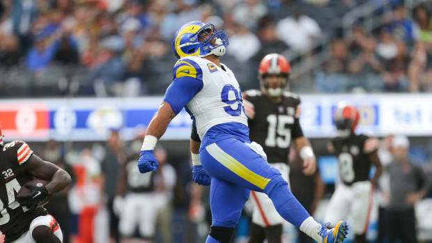 Los Angeles Rams defensive tackle Aaron Donald (99) celebrates in the first half in a game against the Cleveland Browns at SoFi Stadium.