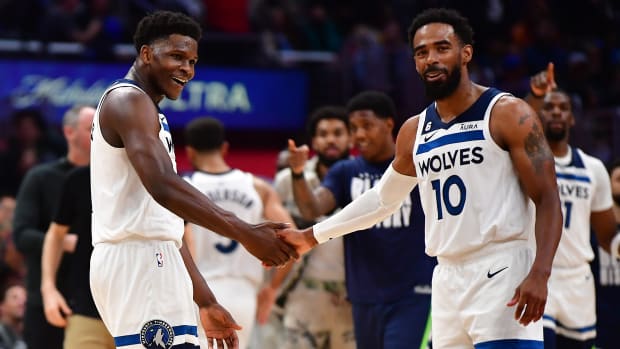 Feb 28, 2023; Los Angeles, California, USA; Minnesota Timberwolves guard Anthony Edwards (1) and guard Mike Conley (10) react against the Los Angeles Clippers during the second half at Crypto.com Arena.