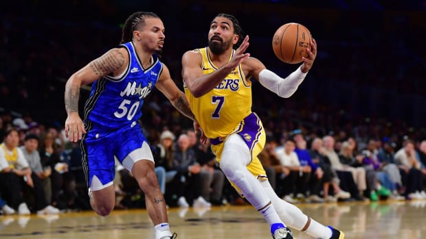 Oct 30, 2023; Los Angeles, California, USA; Los Angeles Lakers guard Gabe Vincent (7) moves to the basket against Orlando Magic guard Cole Anthony (50) during the second half at Crypto.com Arena. Mandatory Credit: Gary A. Vasquez-USA TODAY Sports  
